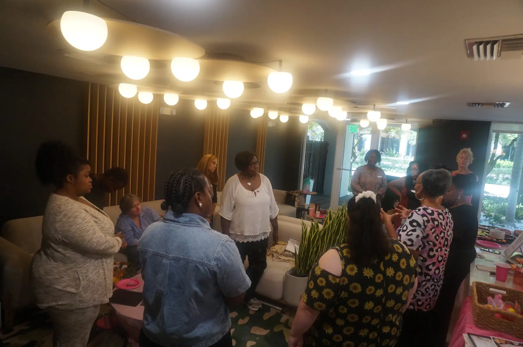 Women standing during the biblical group activity