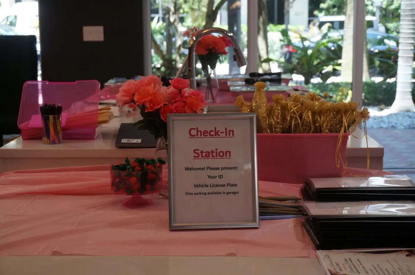 Pink and gold check-in station prepared to welcome guests