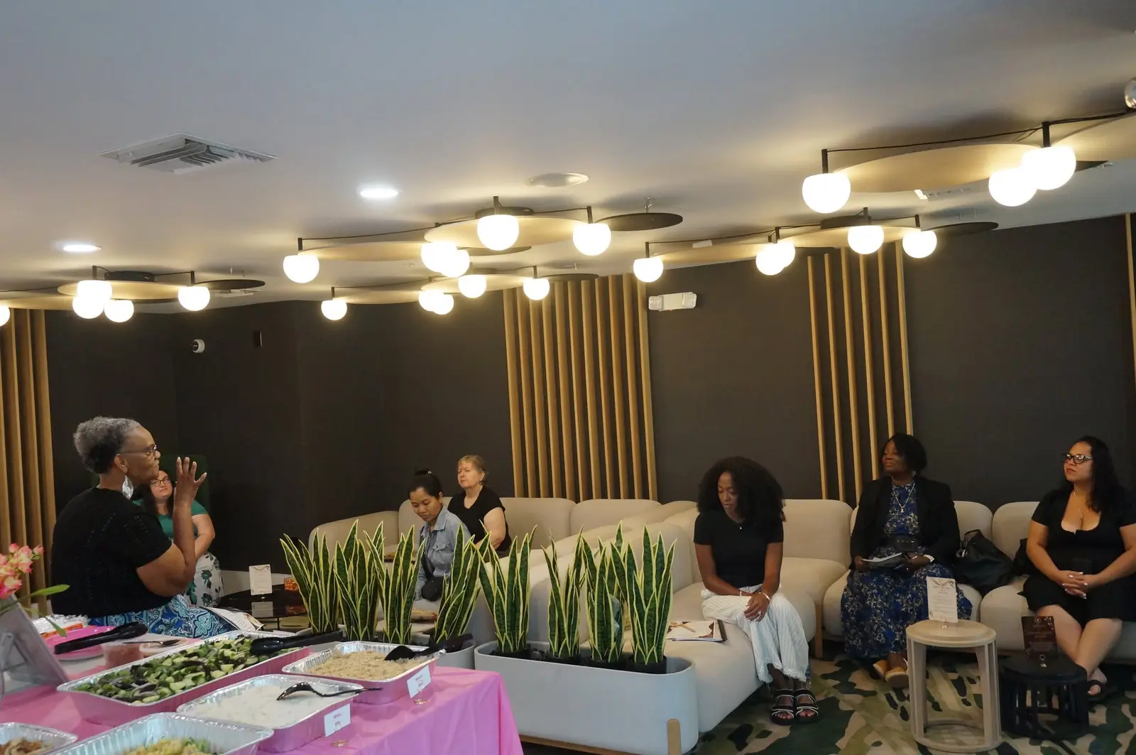 Women listening and connecting during the Dumpling Darlings gathering