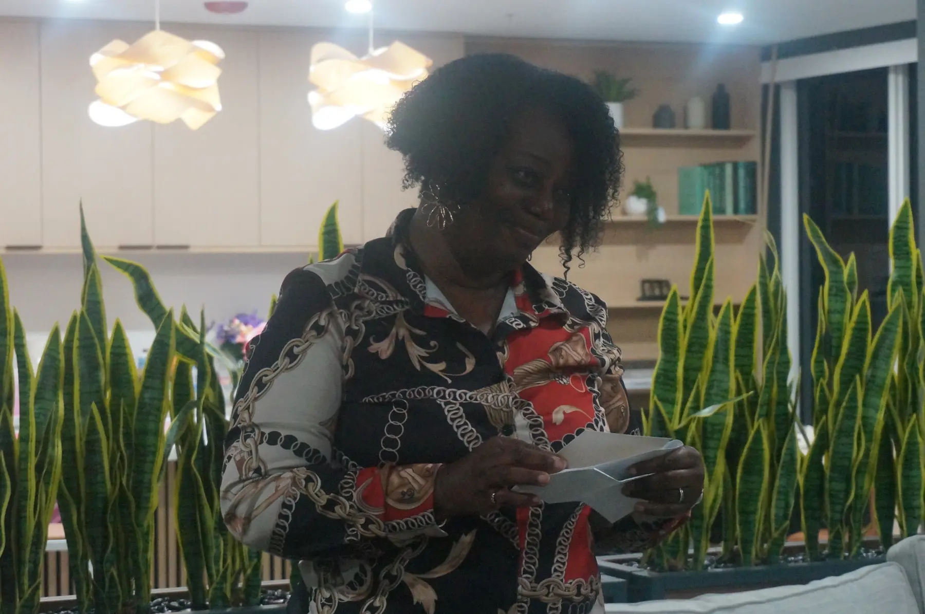 A woman standing and sharing her written response