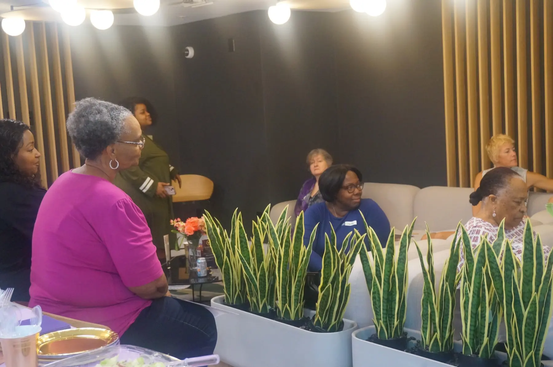 Women gathered and listening during the session