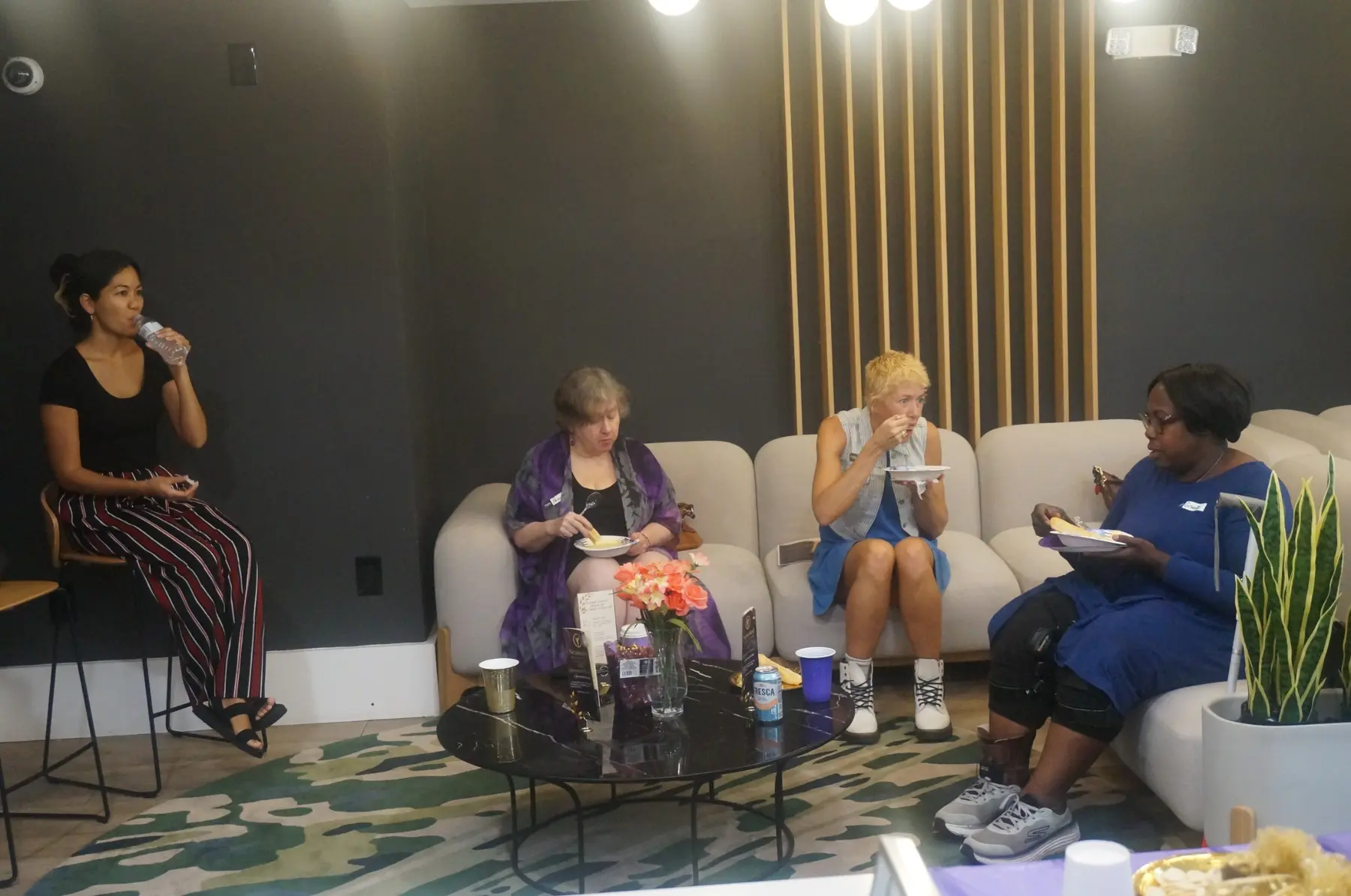 Women sharing a meal before the testimony service