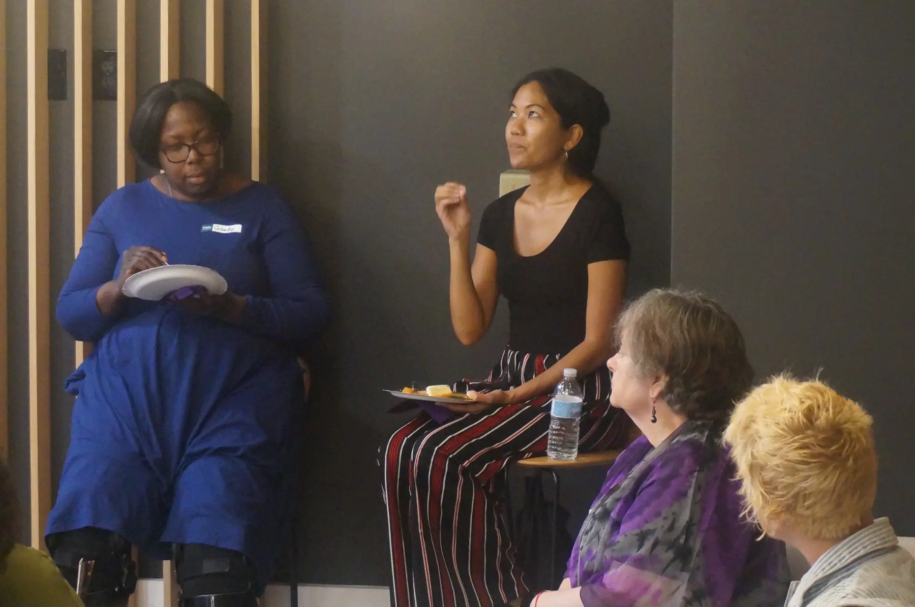 A woman speaking during the testimony service