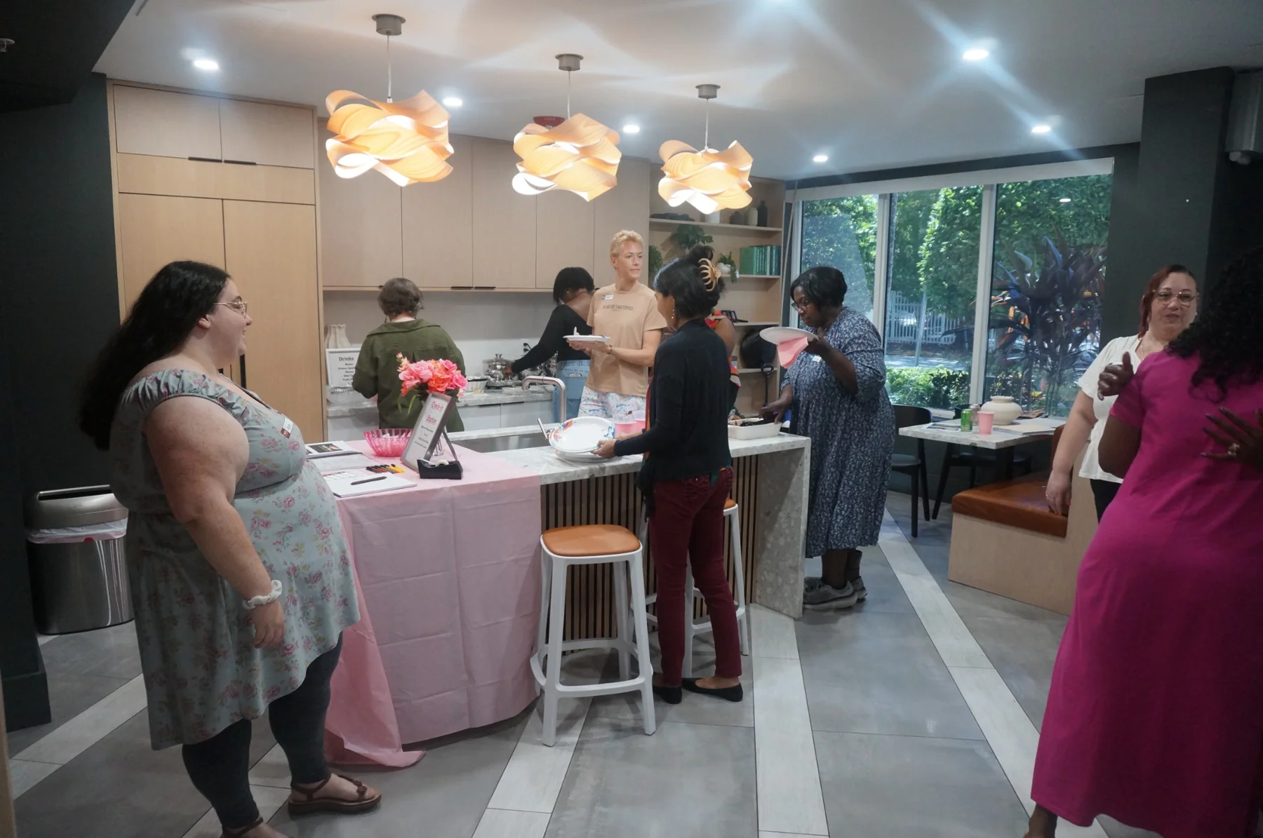 Women gathered beside the dinner buffet