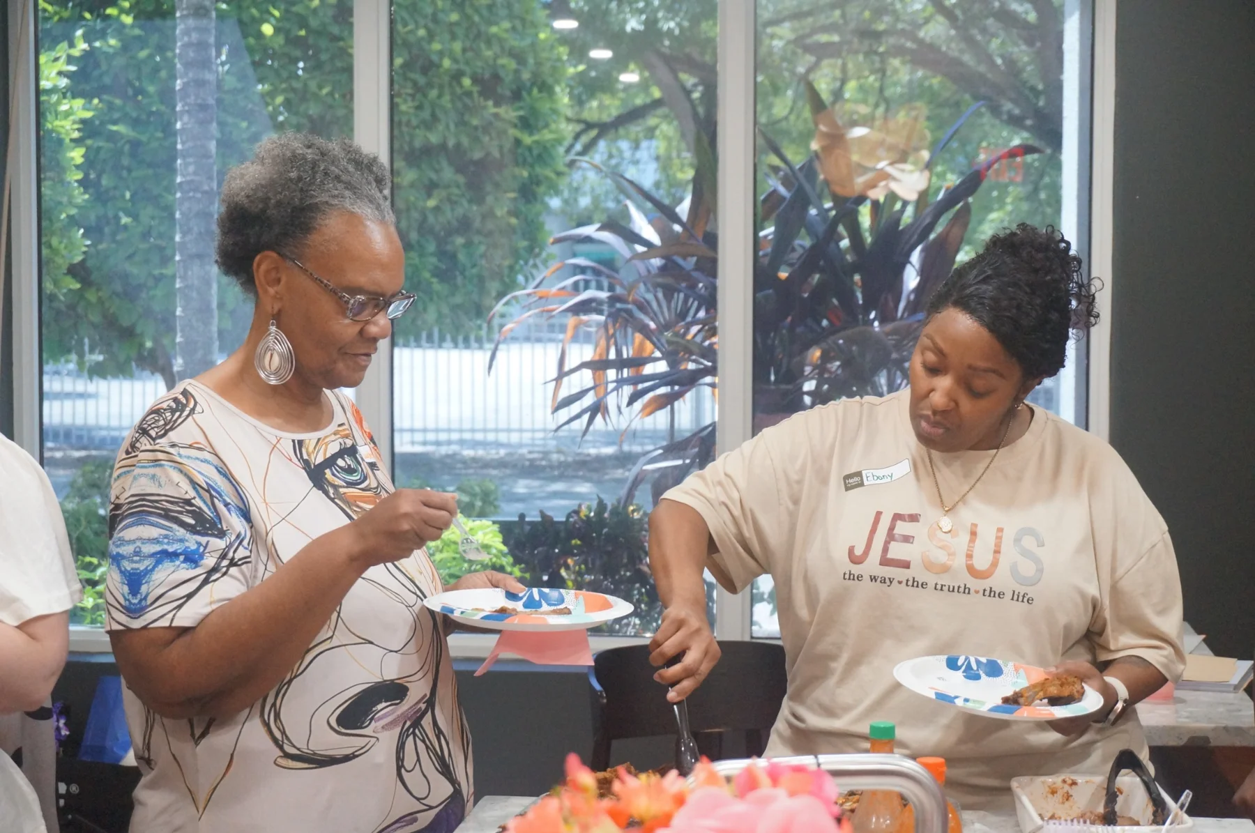 Women serving dinner together