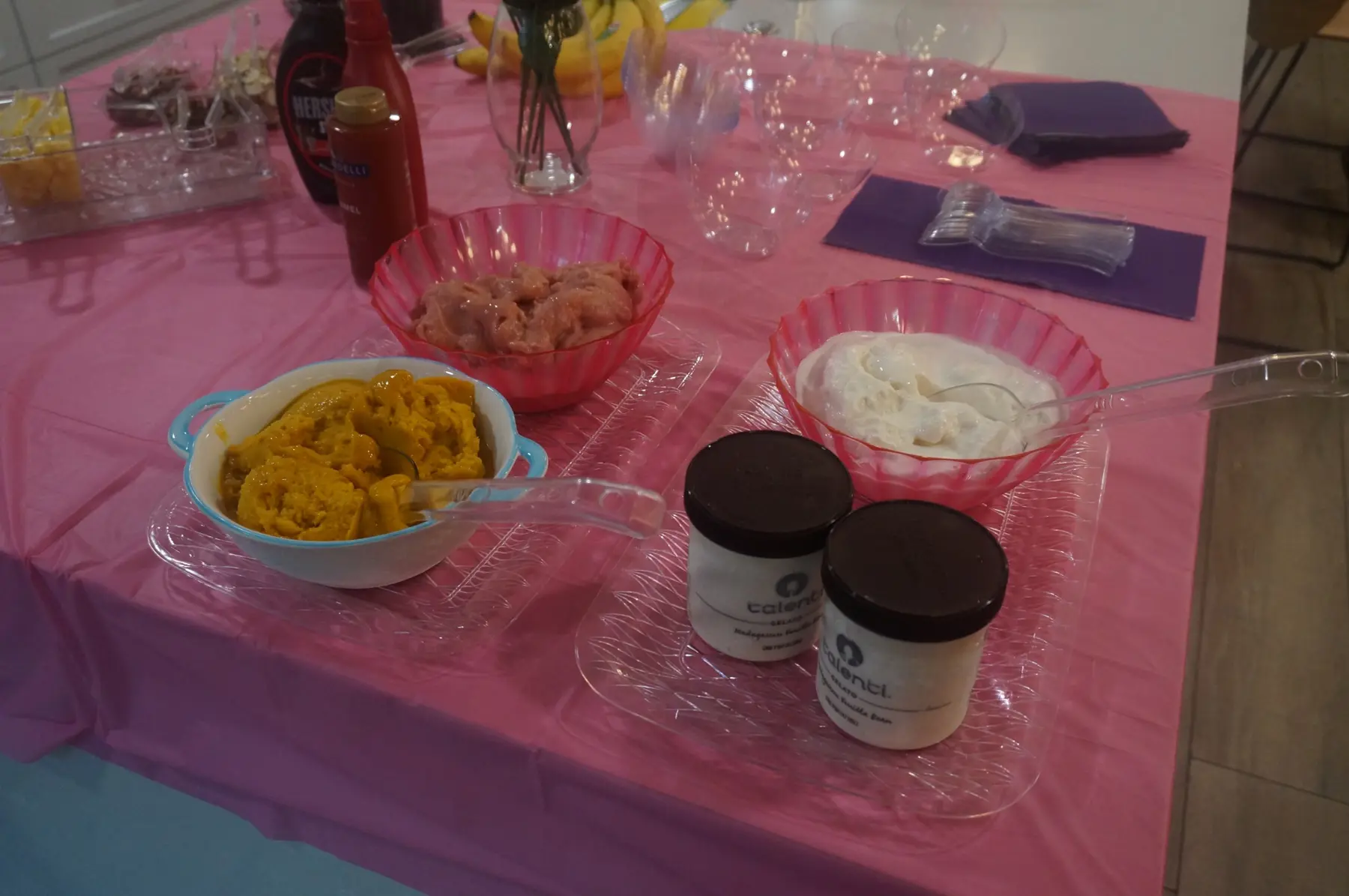 Sorbet, toppings, and serving bowls arranged on the table