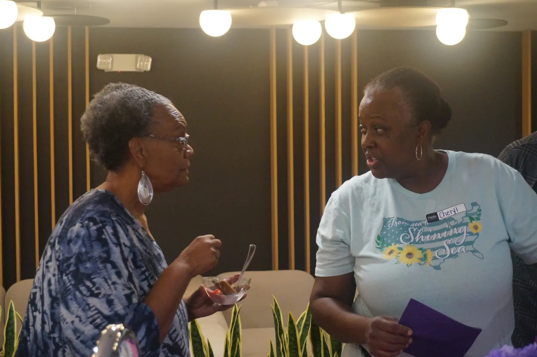 Two women sharing conversation during the sorbet bar