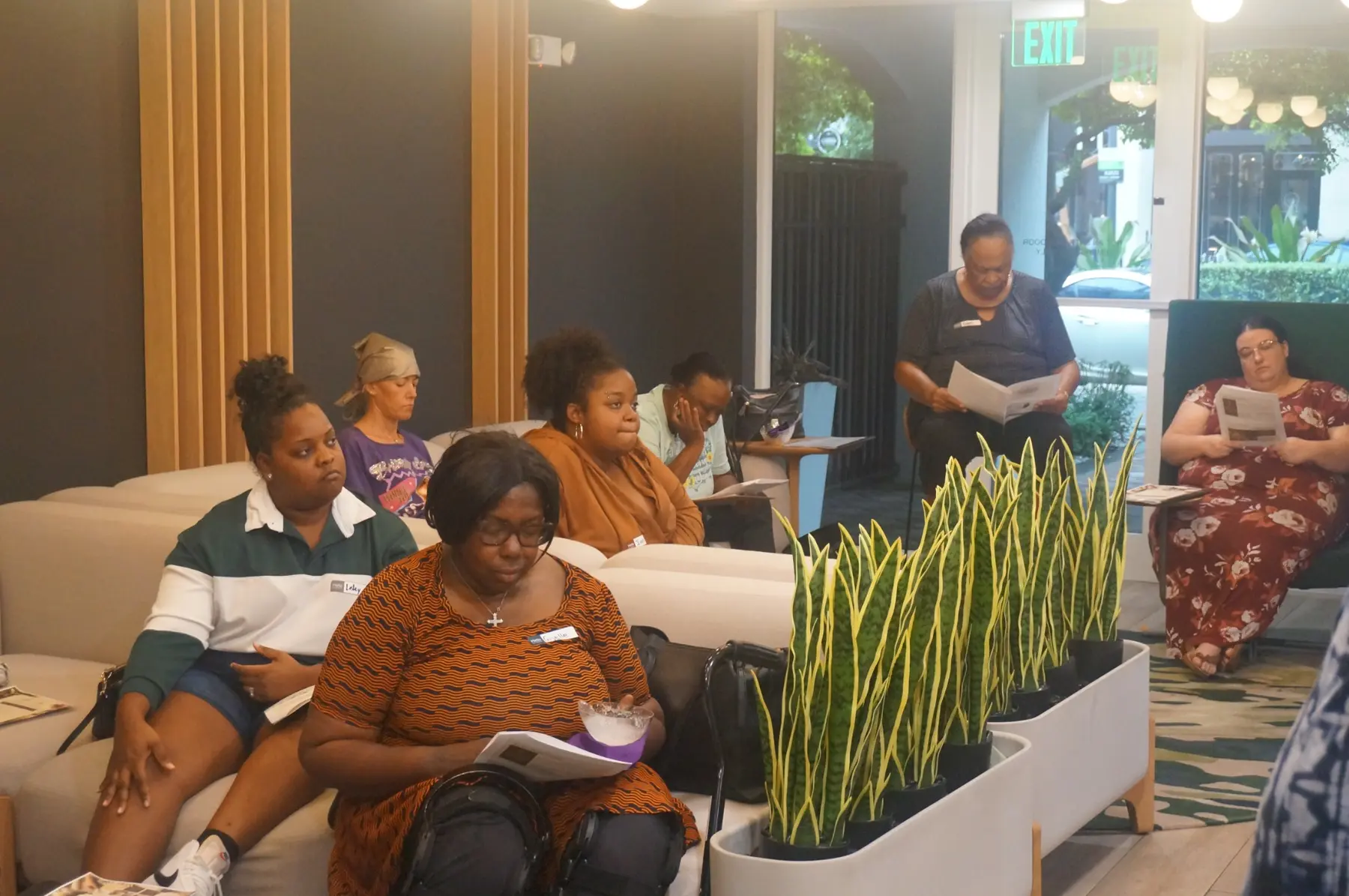 Women taking notes and participating in the teaching