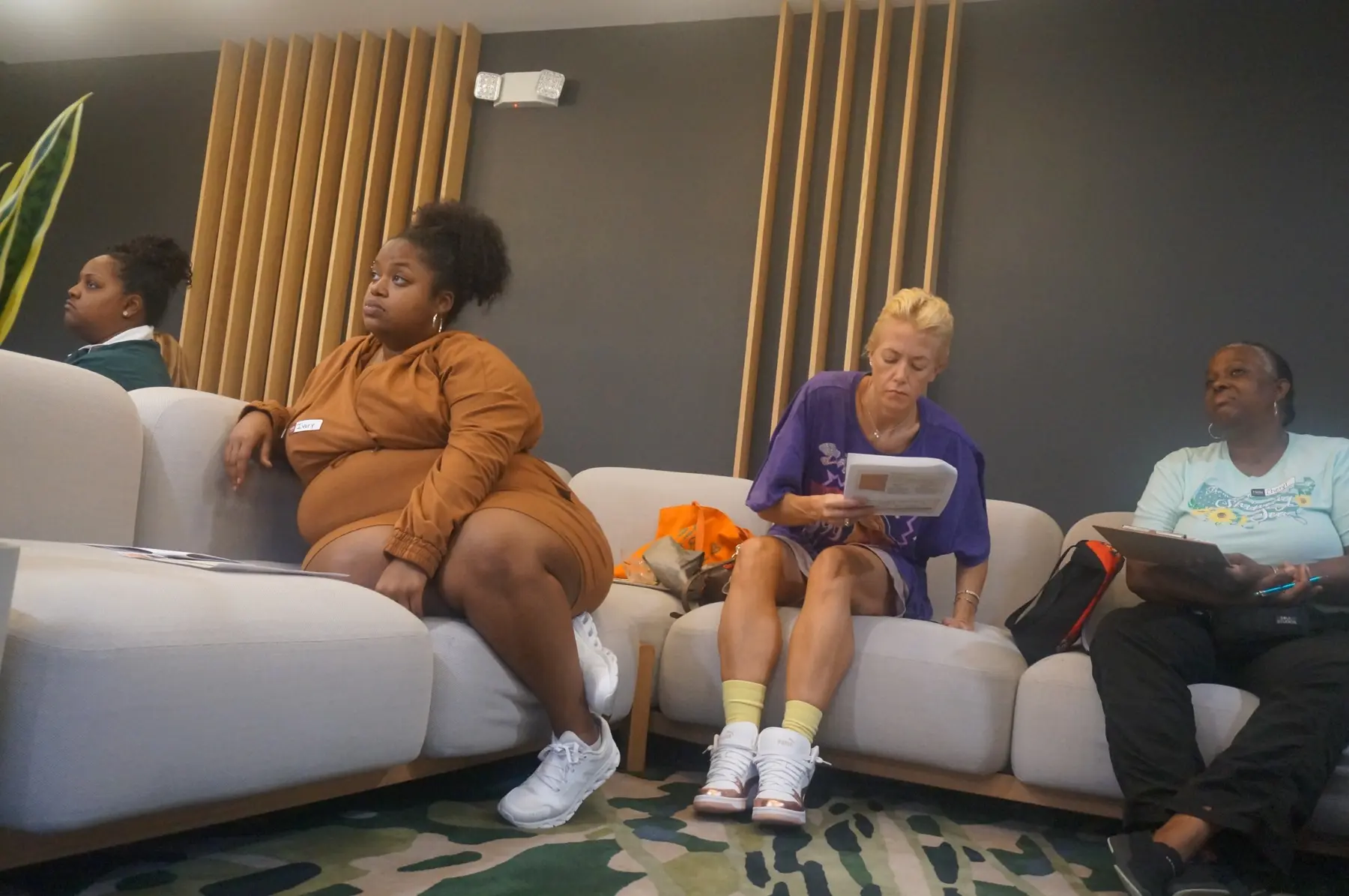 Women following the lesson from their seats