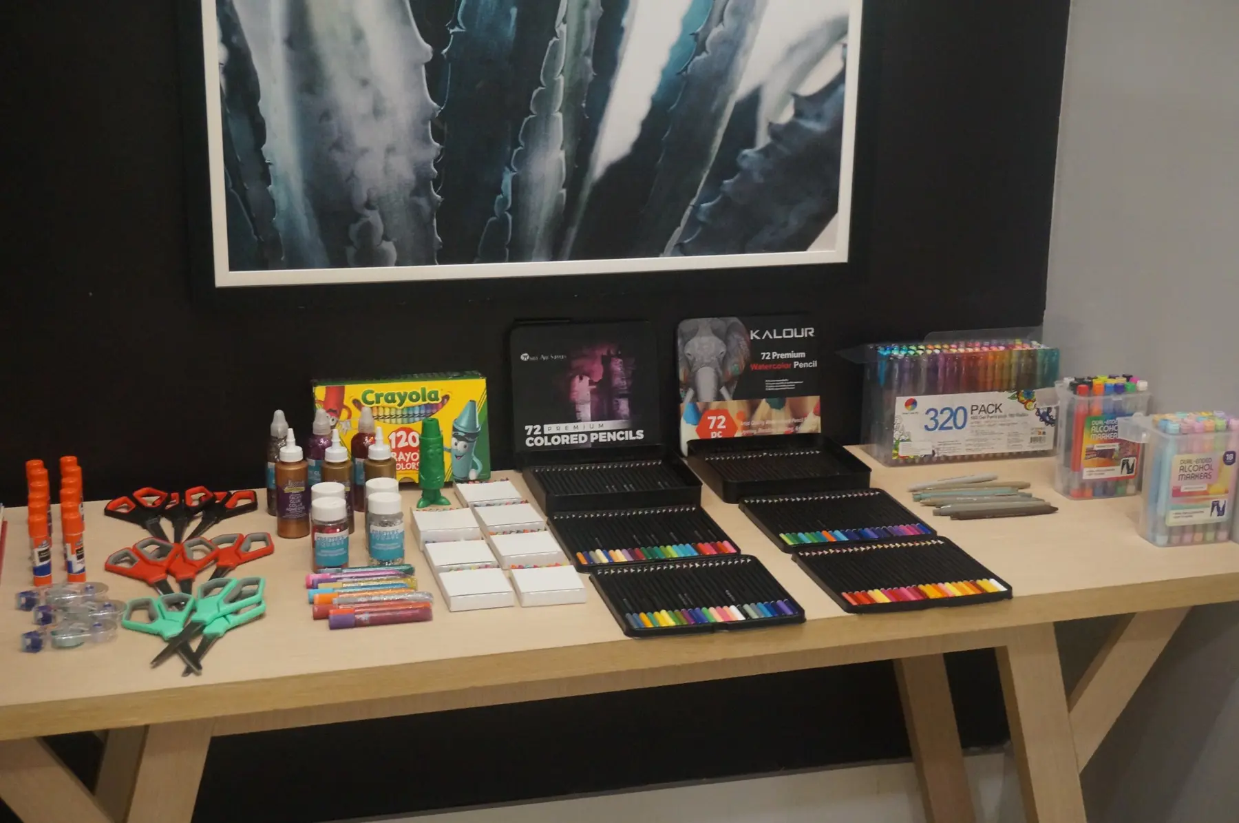 Vision-board art supplies arranged across a table