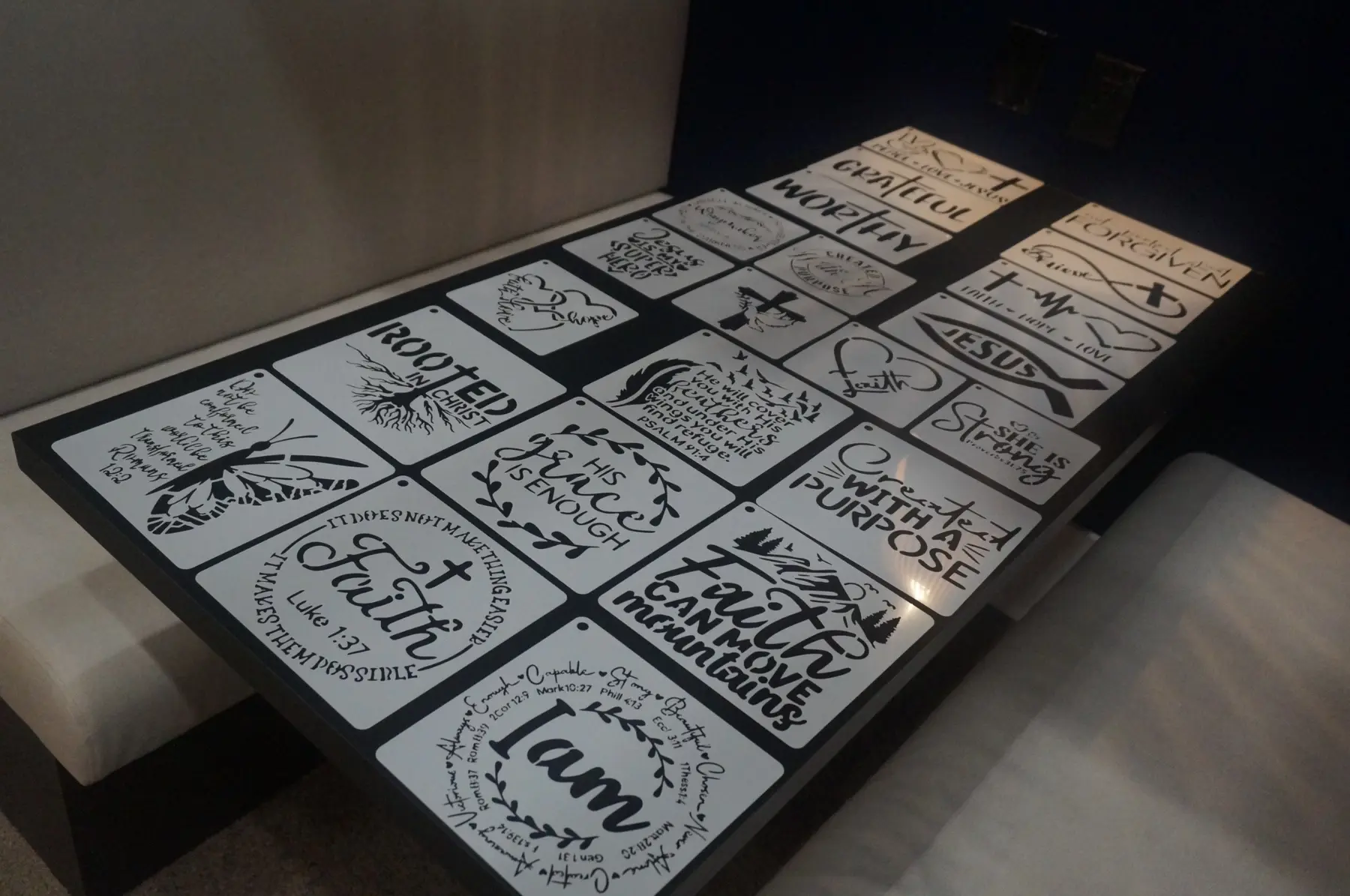 Faith-centered words and Scripture-inspired designs for the boards