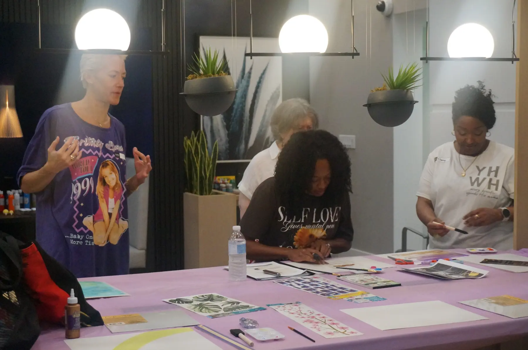 Women working with printed words and images