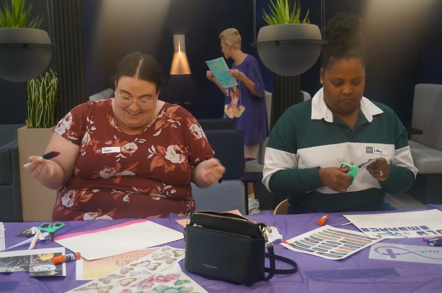 Two women creating vision boards side by side