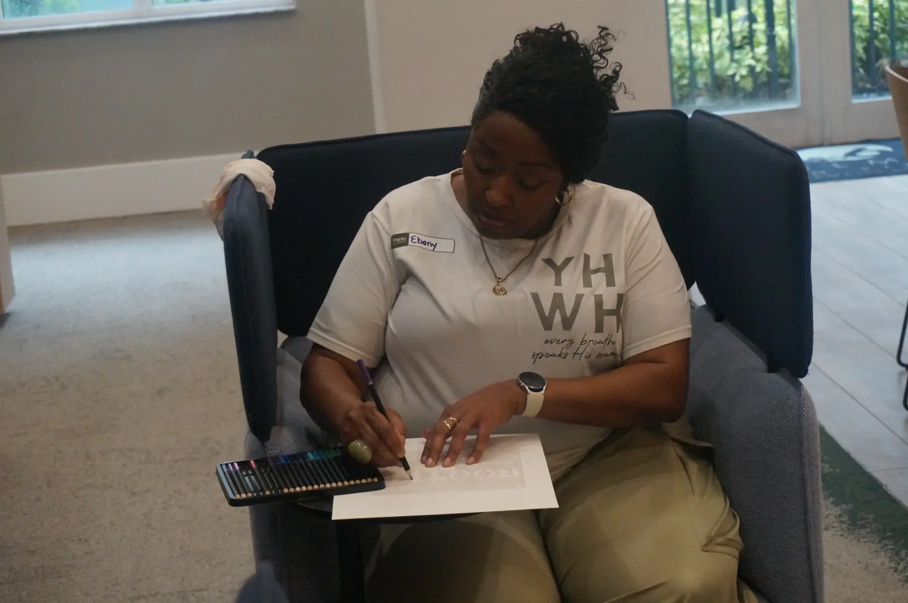 A woman writing and designing her personal vision board