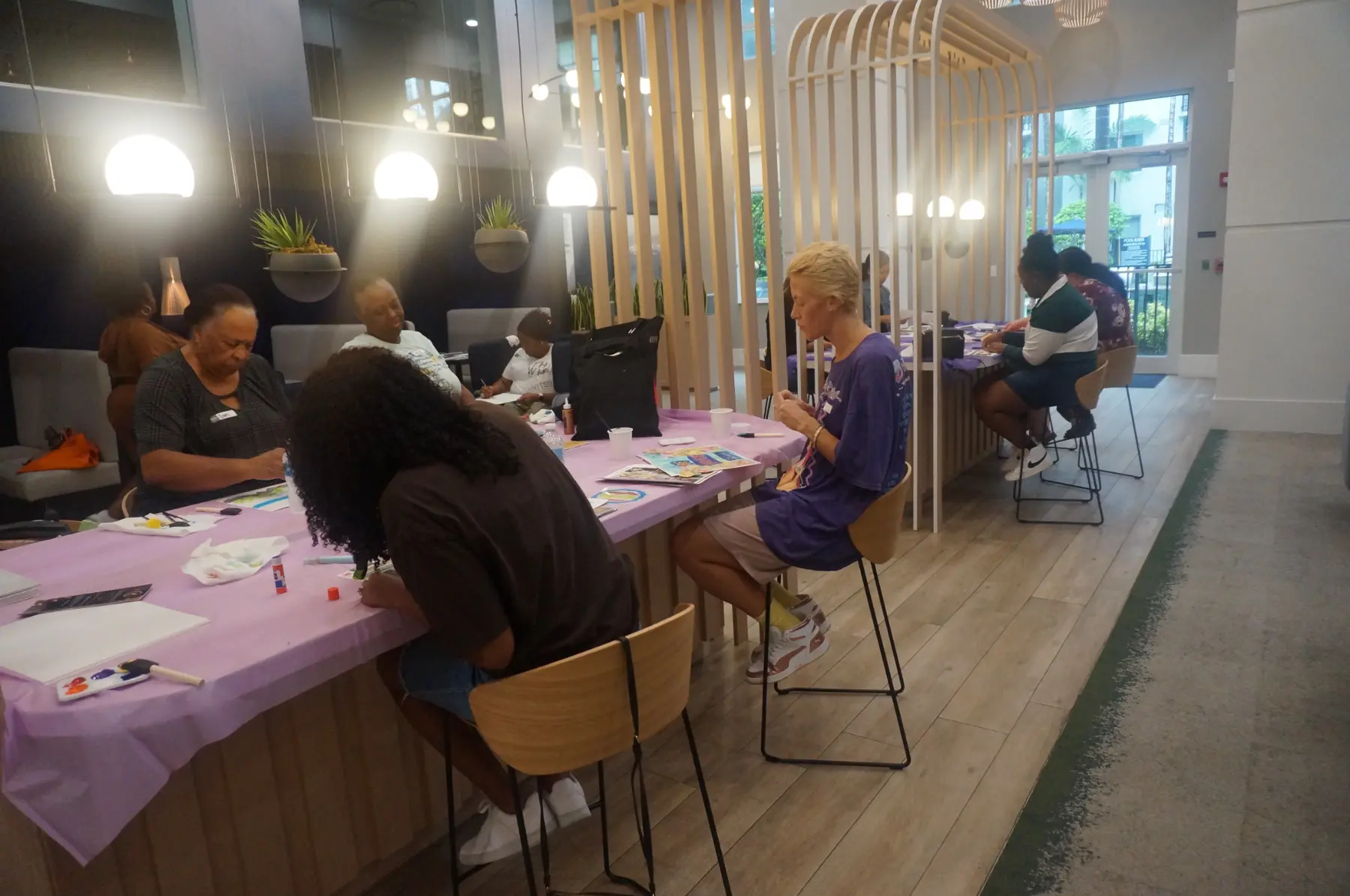 Wide view of women working throughout the vision-board session